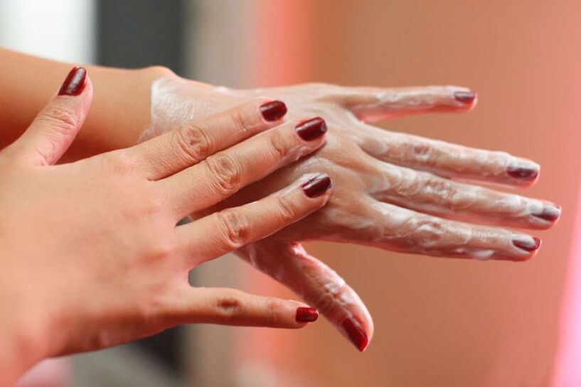 apply cream on hands for skin rejuvenation